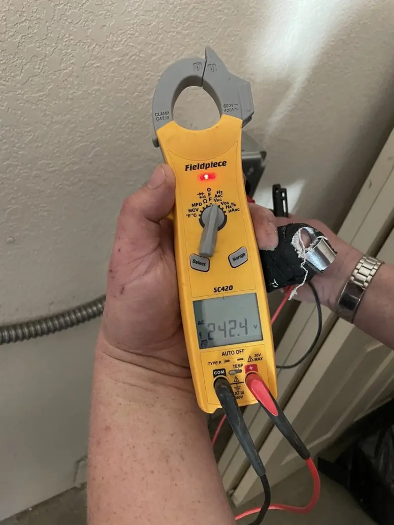Voltage testing with clamp meter during Aluminum Wiring Replacement in Hunter